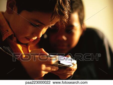 Young boys playing game. View Large Photo Image Stock Image - Young boys playing game.. Fotosearch