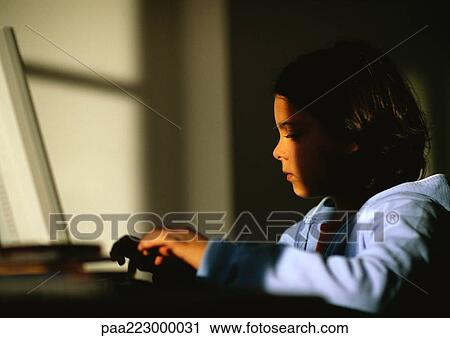 Young girl sitting, playing game. View Large Photo Image Stock Image - Young girl sitting, playing game.. Fotosearch