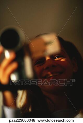 Young girl with camera, smiling, close up. View Large Photo Image Stock Photo - Young girl with camera, smiling, close up.. Fotosearch