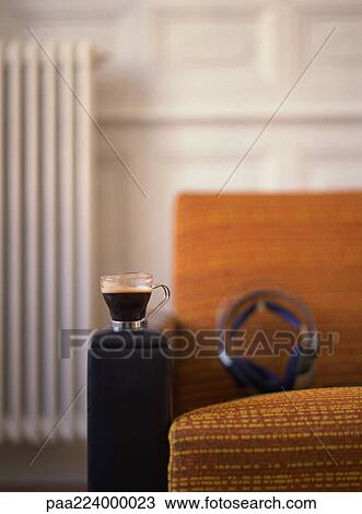 Chair with headphones and cup placed on it. View Large Photo Image Stock Image - Chair with headphones and cup placed on it.. Fotosearch