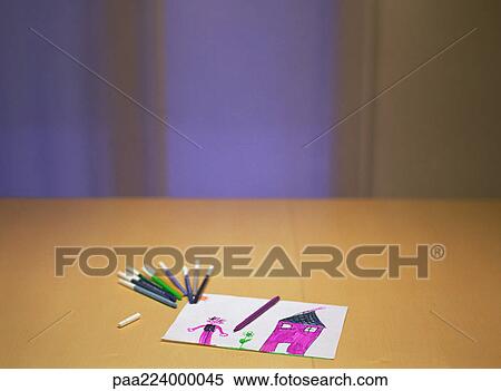 Child's drawing and colored markers on table. View Large Photo Image Stock Photography - Child's drawing and colored markers on table.. Fotosearch