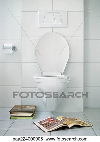 Open book in front of toilet. View Large Photo Image Stock Photography - Open book in front of toilet.. Fotosearch