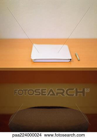 Pen and book on desk. View Large Photo Image Picture - Pen and book on desk.. Fotosearch