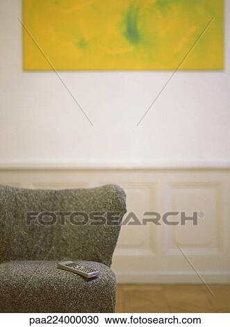 Remote control on chair, partial view. View Large Photo Image Stock Image - Remote control on chair, partial view.. Fotosearch