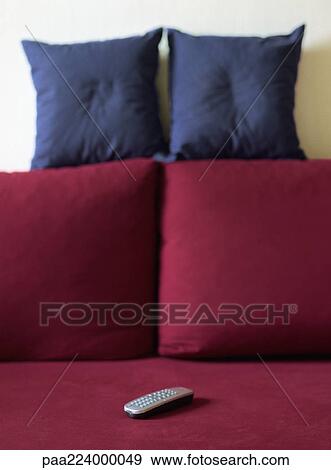 Remote control on couch. View Large Photo Image Stock Photo - Remote control on couch.. Fotosearch