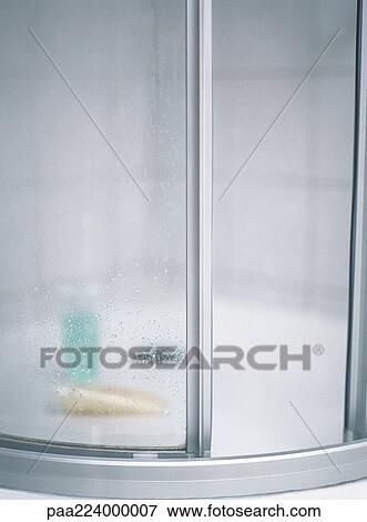 Shower stall, blurred bottles inside. View Large Photo Image Stock Photo - Shower stall, blurred bottles inside.. Fotosearch