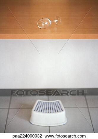 Step stool in front of counter with wine glass on side. View Large Photo Image Stock Image - Step stool in front of counter with wine glass on side.. Fotosearch