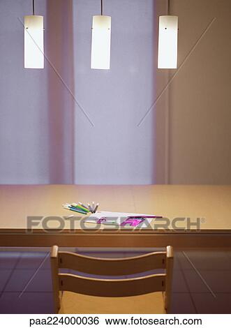 Stock Photograph - Table with child's drawing and markers. Fotosearch