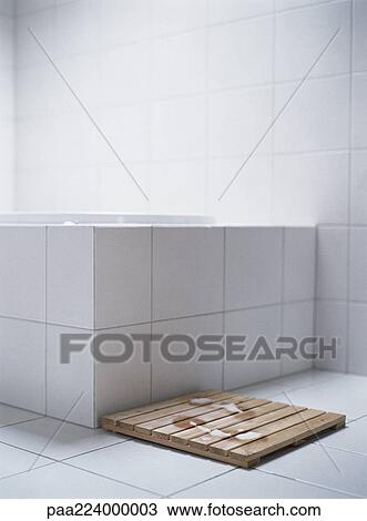 Wet footprints on wooden mat next to bath tub. View Large Photo Image Stock Image - Wet footprints on wooden mat next to bath tub.. Fotosearch
