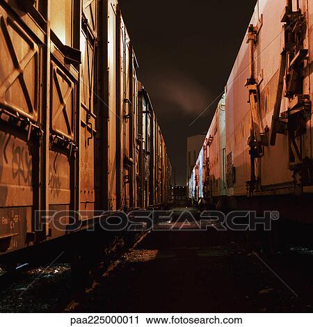 Cargo trains at night, close-up. View Large Photo Image Stock Image - Cargo trains at night, close-up.. Fotosearch