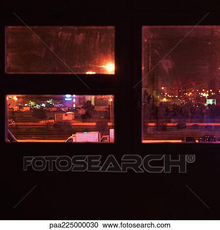 City street, seen through window at night, elevated view. View Large Photo Image Stock Image - City street, seen through window at night, elevated view. . Fotosearch