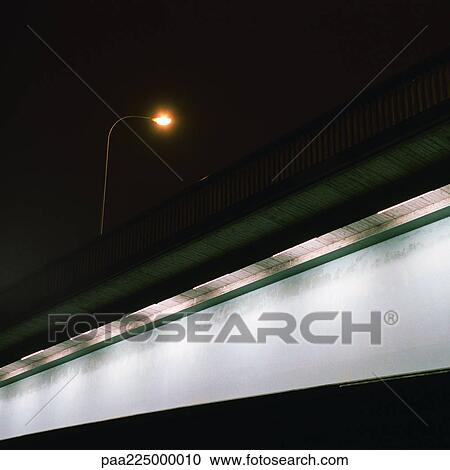 Overhead light on bridge at night. View Large Photo Image Stock Image - Overhead light on bridge at night.. Fotosearch