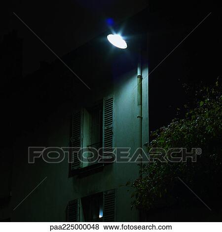 Security light on building, night View Large Photo Image Stock Photo - Security light on building, night. Fotosearch