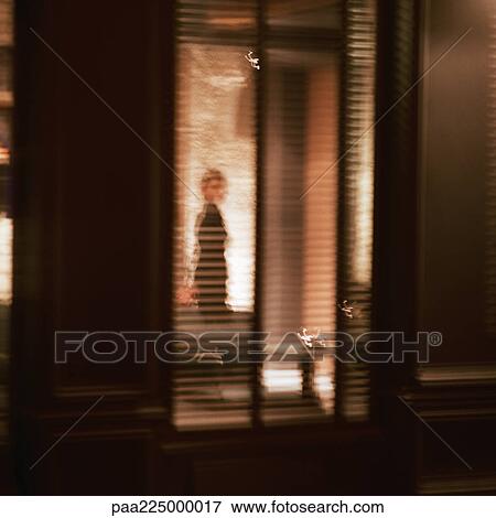 Silhouette through window, night. View Large Photo Image Stock Photo - Silhouette through window, night.. Fotosearch