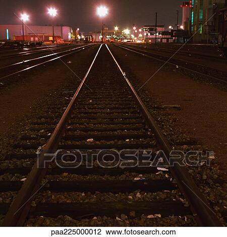 Train tracks at night. View Large Photo Image Stock Image - Train tracks at night.. Fotosearch