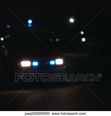 Vehicle with lit headlights, night. View Large Photo Image Stock Image - Vehicle with lit headlights, night.. Fotosearch