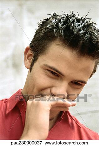 Man holding hand to face, portrait. View Large Photo Image Stock Photo - Man holding hand to face, portrait.. Fotosearch