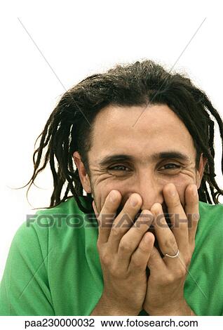 Man smiling, covering mouth with hands, portrait. View Large Photo Image Stock Image - Man smiling, covering mouth with hands, portrait.. Fotosearch