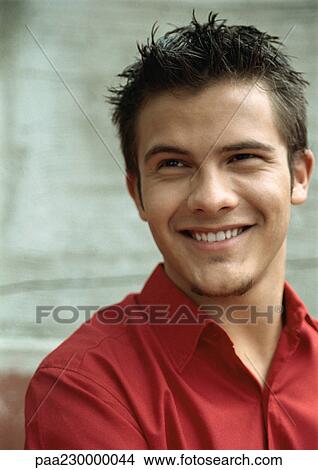 Man smiling, looking away, portrait. View Large Photo Image Picture - Man smiling, looking away, portrait.. Fotosearch