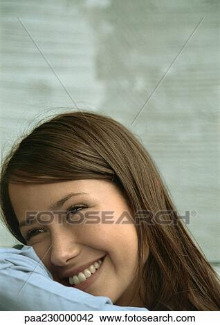Woman resting head on arm, smiling, portrait. View Large Photo Image Stock Image - Woman resting head on arm, smiling, portrait.. Fotosearch