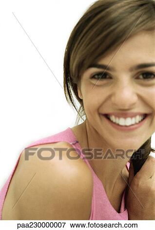 Stock Photo - Woman smiling at camera, close up portrait.. Fotosearch