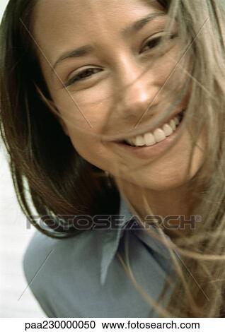 Woman smiling, hair in face, close up portrait. View Large Photo Image Stock Image - Woman smiling, hair in face, close up portrait.. Fotosearch