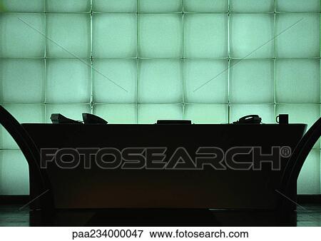 Desk in front of windows, silhouette. View Large Photo Image Stock Photo - Desk in front of windows, silhouette.. Fotosearch