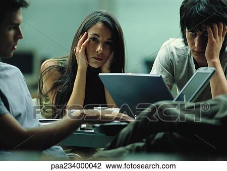 Man and woman, hands on heads, in group, looking at camera. View Large Photo Image Stock Image - Man and woman, hands on heads, in group, looking at camera.. Fotosearch