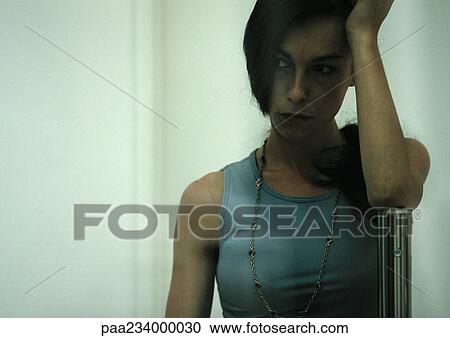 Woman holding head, looking to the side, close up. View Large Photo Image Stock Image - Woman holding head, looking to the side, close up.. Fotosearch