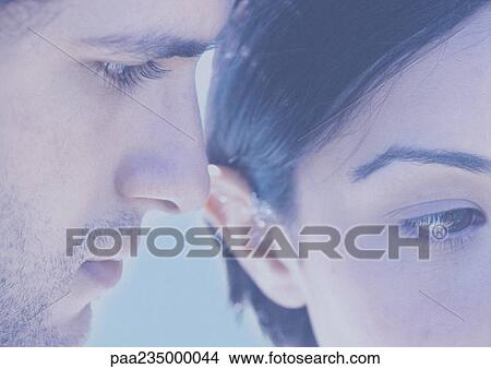Picture - Man and woman with faces next to each other, close up. Fotosearch