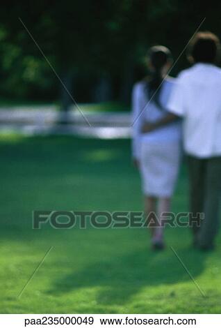 Man and women walking together, view from behind, blurred. View Large Photo Image Stock Photo - Man and women walking together, view from behind, blurred.. Fotosearch
