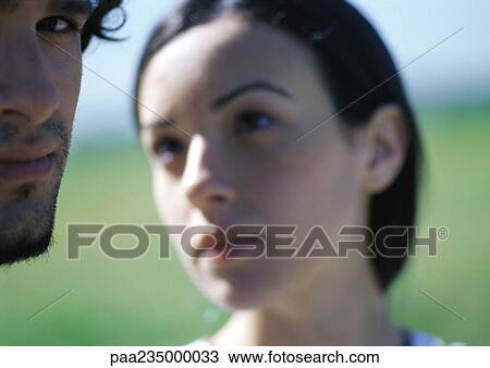Woman looking at man, close up. View Large Photo Image Stock Image - Woman looking at man, close up.. Fotosearch
