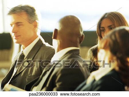 Business people sitting and talking to each other. View Large Photo Image Stock Image - Business people sitting and talking to each other.. Fotosearch