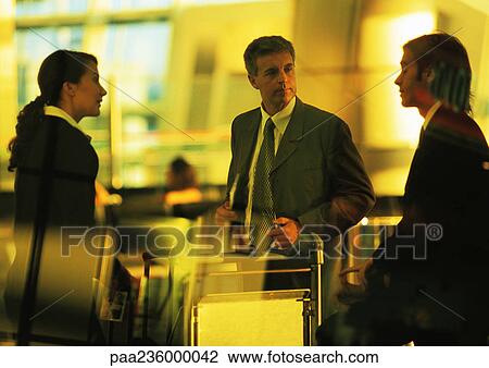 Business people standing together, View Large Photo Image Stock Image - Business people standing together,. Fotosearch