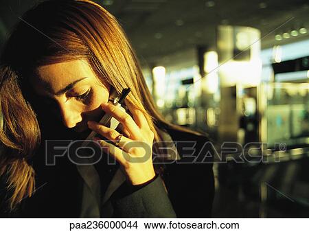 Picture - Businesswoman talking on cell phone, close up.. Fotosearch