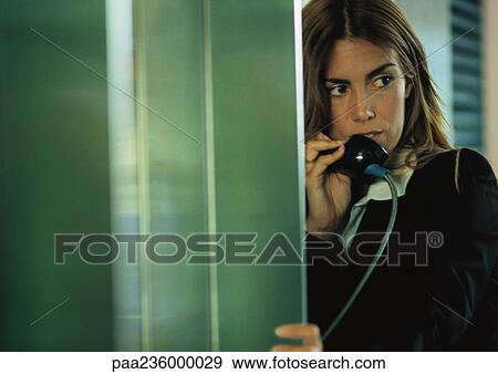 Businesswoman talking on public pay phone. View Large Photo Image Stock Photo - Businesswoman talking on public pay phone.. Fotosearch