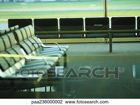 Row of empty seats at airport terminal. View Large Photo Image Stock Image - Row of empty seats at airport terminal.. Fotosearch
