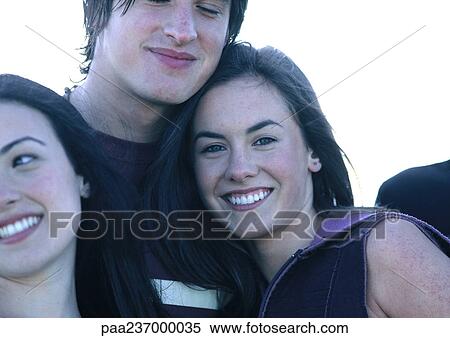 Friends smiling, close-up. View Large Photo Image Stock Photography - Friends smiling, close-up.. Fotosearch