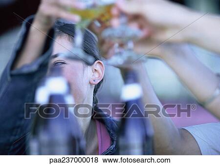 People clanking glasses together, close-up. View Large Photo Image Stock Photo - People clanking glasses together, close-up.. Fotosearch