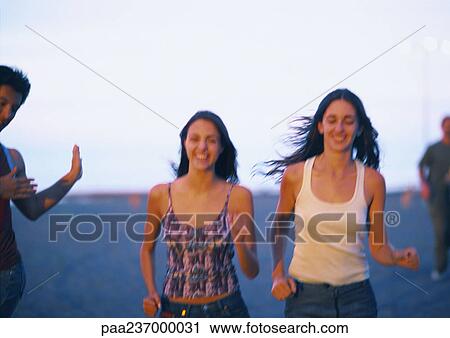 Woman running near water at sunset, blurred. View Large Photo Image Stock Image - Woman running near water at sunset, blurred.. Fotosearch