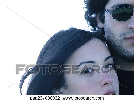 Woman standing next to man in sunglasses, partial view of faces. View Large Photo Image Stock Image - Woman standing next to man in sunglasses, partial view of faces.. Fotosearch