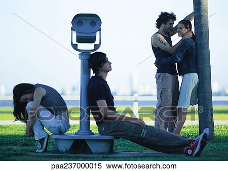 Young people hanging out near water View Large Photo Image Stock Photography - Young people hanging out near water. Fotosearch