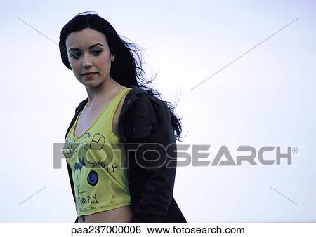 Young woman looking down, portrait. View Large Photo Image Stock Photograph - Young woman looking down, portrait.. Fotosearch