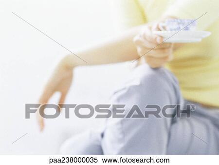 Woman holding teacup, close-up View Large Photo Image Stock Photography - Woman holding teacup, close-up. Fotosearch