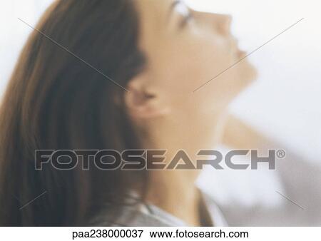 Woman leaning head backward, close-up, blurred View Large Photo Image Stock Photo - Woman leaning head backward, close-up, blurred. Fotosearch