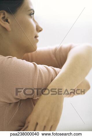 Woman taking shirt off, side view, close-up View Large Photo Image Stock Image - Woman taking shirt off, side view, close-up. Fotosearch