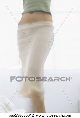 Young woman in skirt, mid section, blurred View Large Photo Image Stock Image - Young woman in skirt, mid section, blurred. Fotosearch