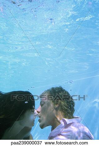 Couple kissing underwater View Large Photo Image Stock Photo - Couple kissing underwater. Fotosearch