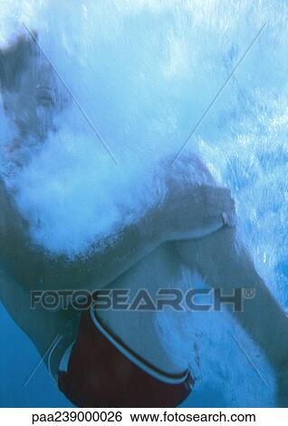 Man holding legs underwater View Large Photo Image Stock Photograph - Man holding legs underwater. Fotosearch