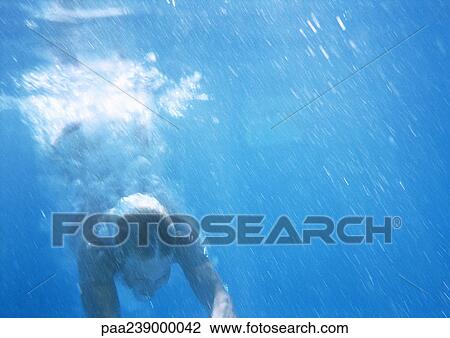 Person swimming underwater View Large Photo Image Stock Image - Person swimming underwater. Fotosearch